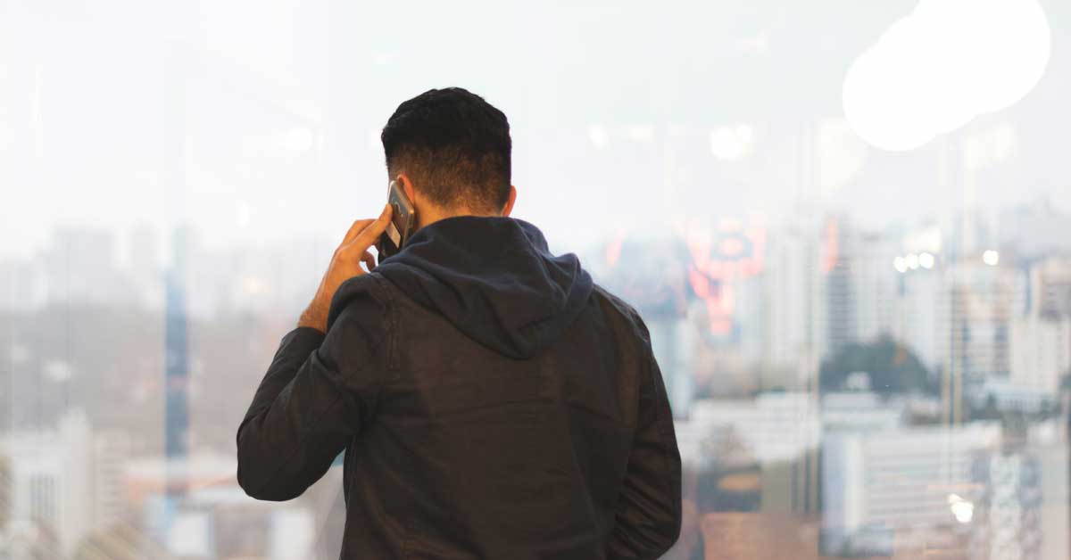 man in an office on the phone in casual clothes